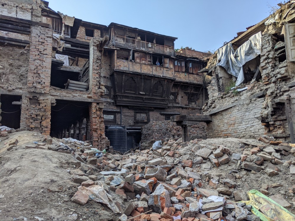 Fallen brick building and a pile of bricks